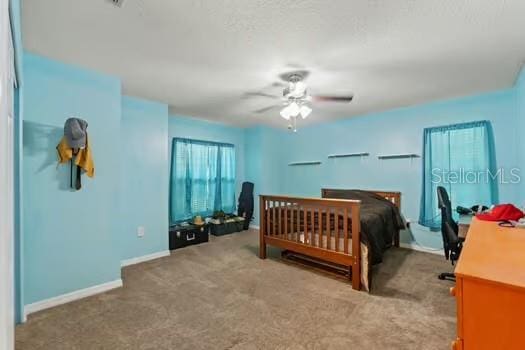 5216 Hope Ln, Spring Hill, FL 34606 - carpeted bedroom featuring baseboards and ceiling fan