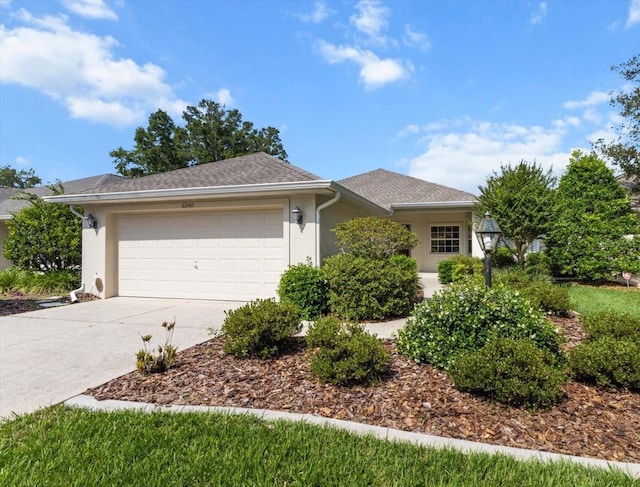 6240 W Glynborne Loop, Crystal River, FL 34429 - ranch-style house with a garage, concrete driveway, stucco siding, and roof with shingles