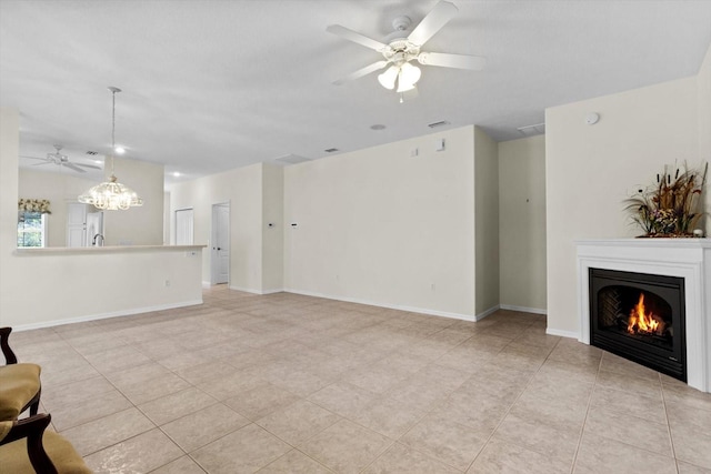 6240 W Glynborne Loop, Crystal River, FL 34429 - unfurnished living room with a ceiling fan, a warm lit fireplace, light tile patterned flooring, a chandelier, and baseboards
