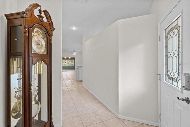 6240 W Glynborne Loop, Crystal River, FL 34429 - foyer featuring light tile patterned floors, ceiling fan, and baseboards