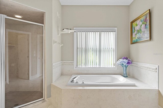 6240 W Glynborne Loop, Crystal River, FL 34429 - bathroom with a bath, a shower stall, and tile patterned floors