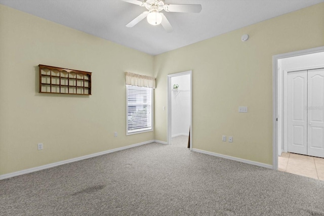 6240 W Glynborne Loop, Crystal River, FL 34429 - unfurnished bedroom with carpet, baseboards, a closet, ceiling fan, and a spacious closet