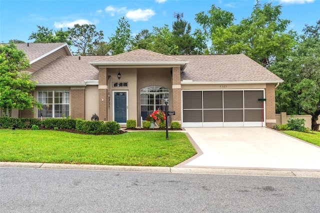 7367 Willow Brook Dr, Spring Hill, FL 34606 - single story home featuring a garage, a front yard, driveway, and brick siding