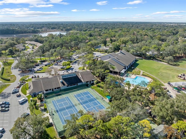 7367 Willow Brook Dr, Spring Hill, FL 34606 - aerial view of property and surrounding area featuring a heavily wooded area, a pool area, and a nearby body of water