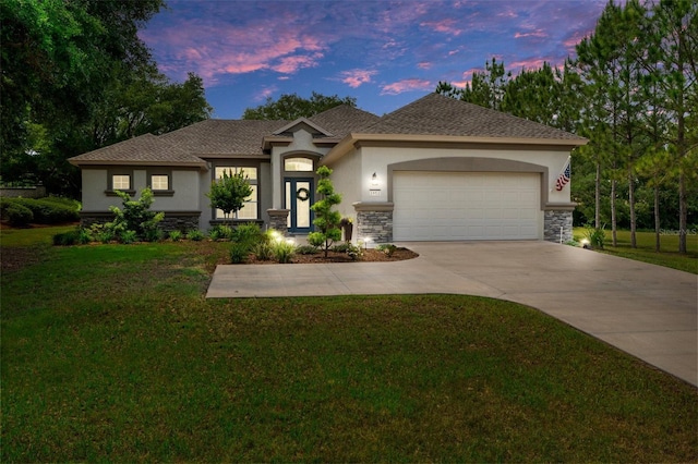 1952 N Essex Ave, Hernando, FL 34442 - view of front of house featuring stucco siding, stone siding, a garage, and a front lawn