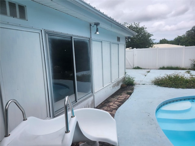 view of patio / terrace featuring fence