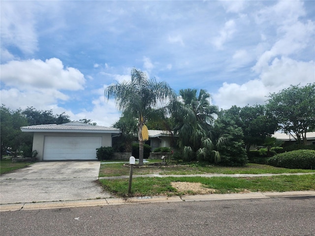 view of front of property with driveway, stucco siding, and an attached garage
