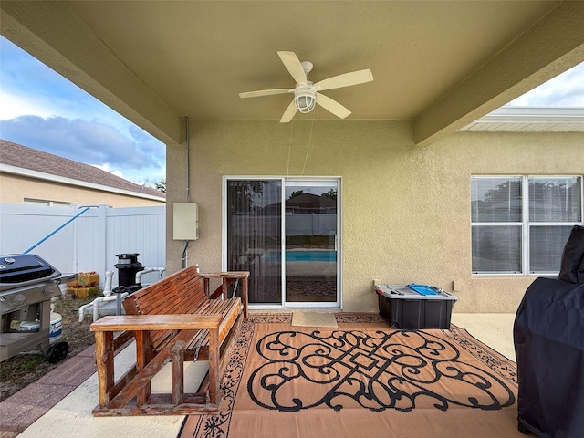 view of patio / terrace featuring a ceiling fan, fence, and area for grilling