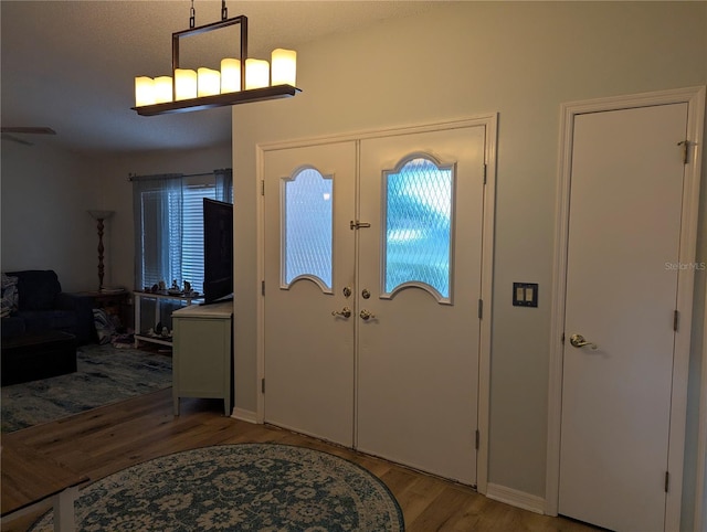 entryway with light wood-style flooring and french doors