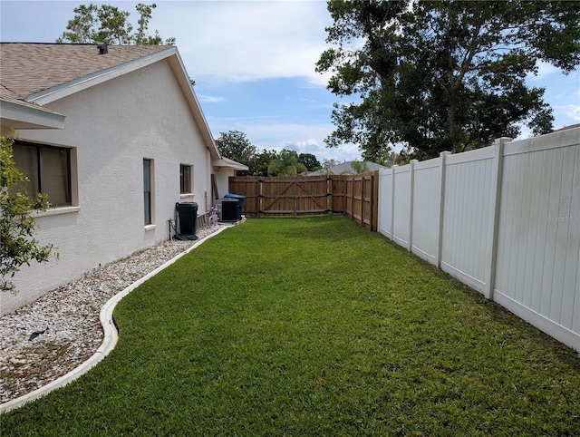view of yard with a gate