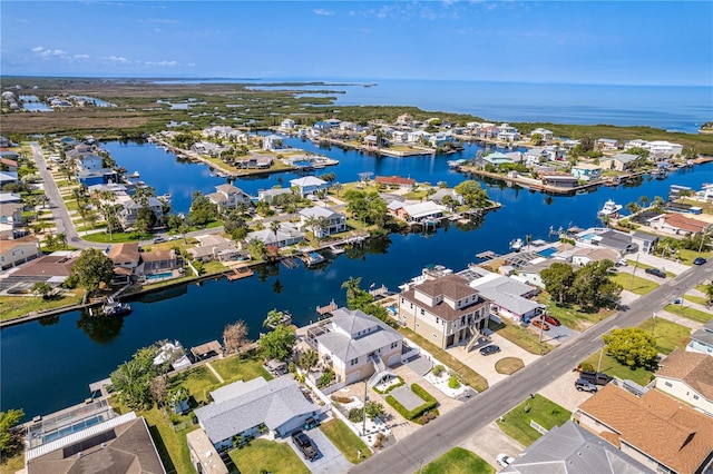 aerial view of residential area with a nearby body of water