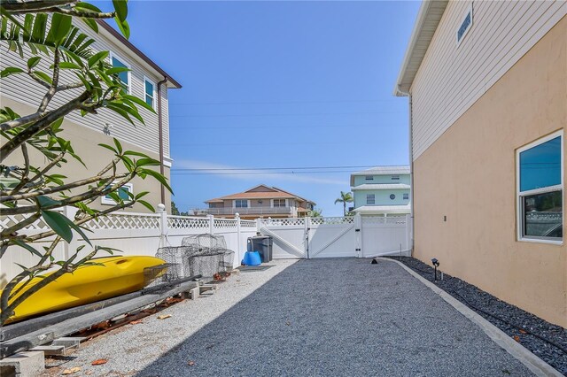view of patio featuring a gate and fence