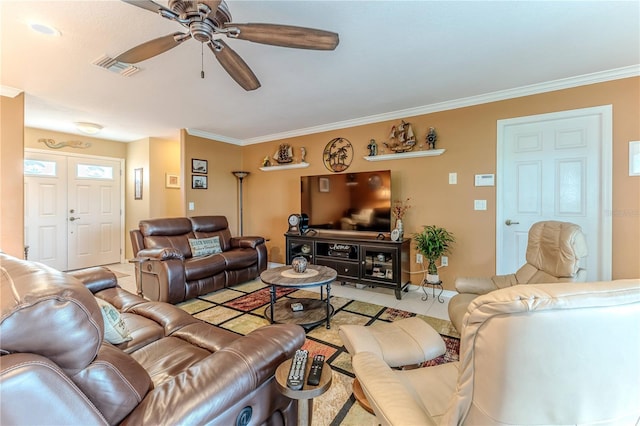 living area with a ceiling fan and crown molding