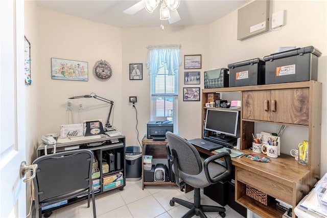 office featuring light tile patterned floors and ceiling fan