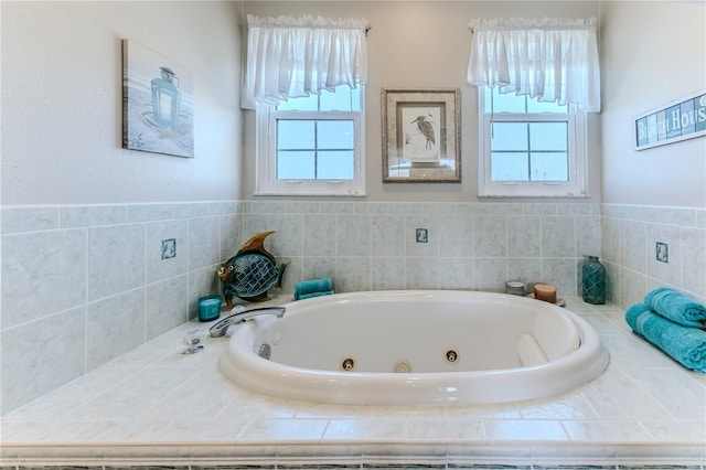 full bath with plenty of natural light and a jetted tub