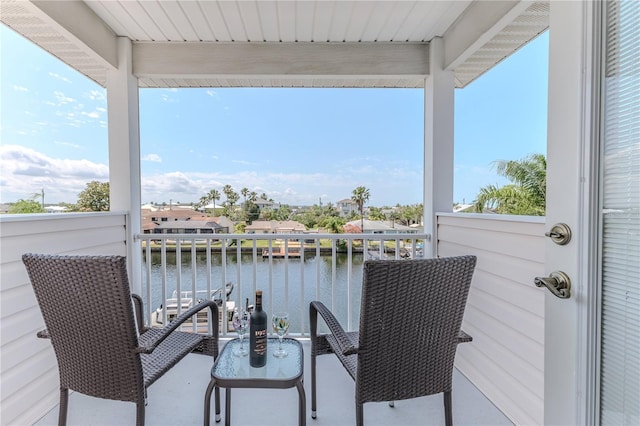 balcony featuring a water view