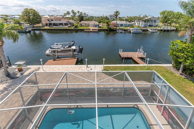 dock with a water view, an outdoor pool, a residential view, glass enclosure, and a patio area