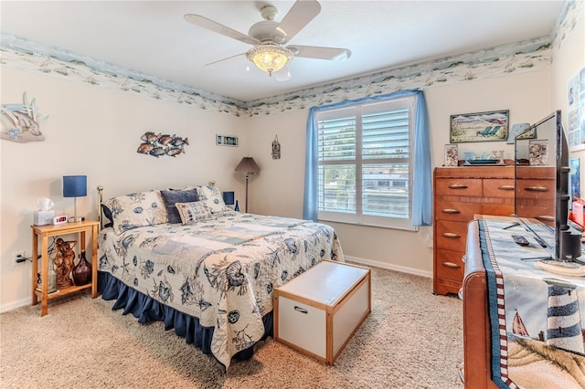 bedroom with light carpet, baseboards, and a ceiling fan