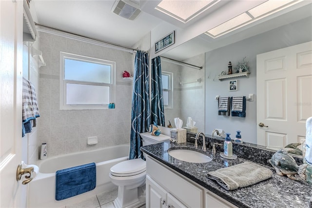full bath with shower / tub combo with curtain, vanity, toilet, and tile patterned floors