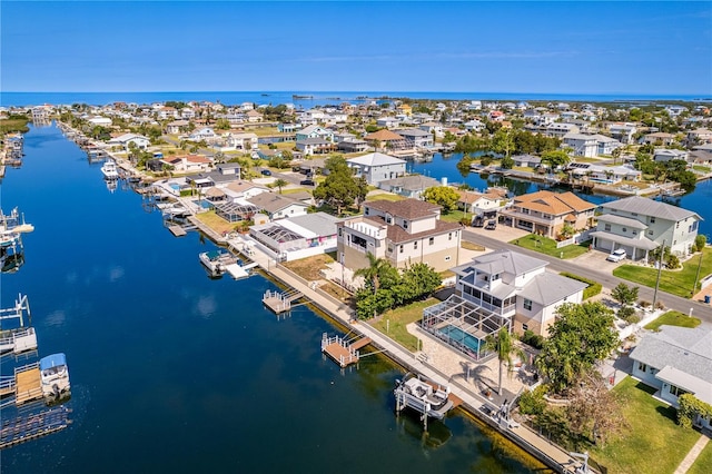 aerial view of residential area featuring a nearby body of water