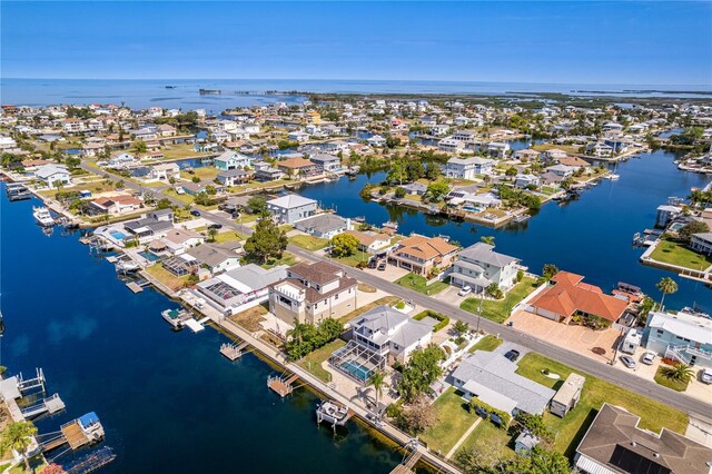 aerial view of residential area with a nearby body of water