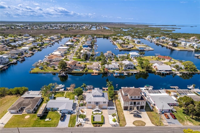 aerial view of residential area featuring a nearby body of water