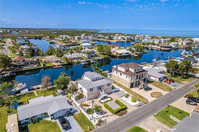 aerial perspective of suburban area with a nearby body of water