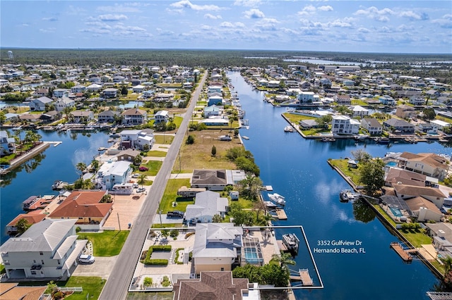 aerial view of residential area with a nearby body of water