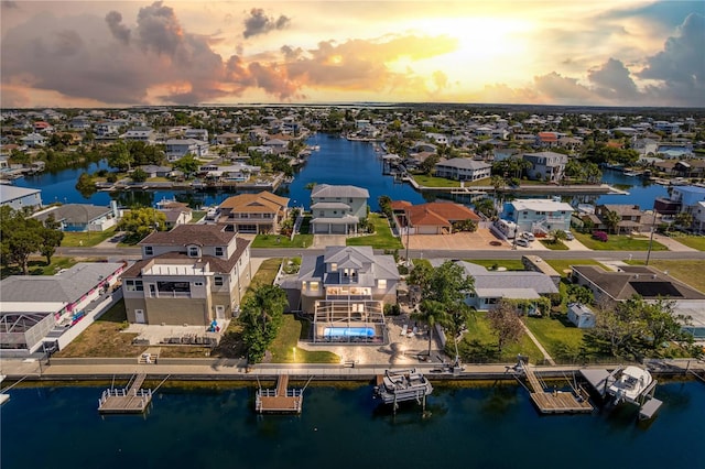 aerial perspective of suburban area featuring a large body of water