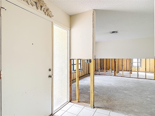 4420 Marine Pkwy, New Port Richey, FL 34652 - foyer featuring a textured ceiling