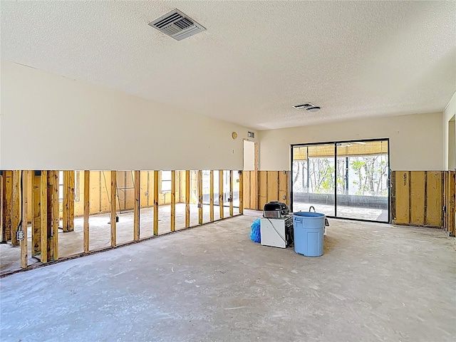 4420 Marine Pkwy, New Port Richey, FL 34652 - unfurnished room featuring a textured ceiling and concrete flooring