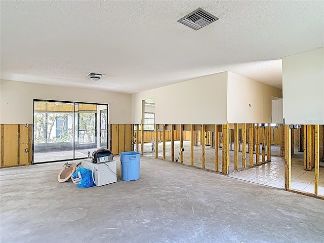 4420 Marine Pkwy, New Port Richey, FL 34652 - spare room featuring a textured ceiling and concrete flooring