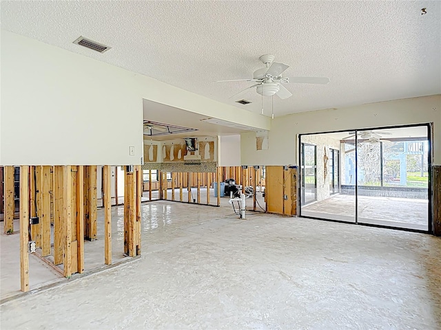 4420 Marine Pkwy, New Port Richey, FL 34652 - empty room with a ceiling fan, a textured ceiling, and concrete floors