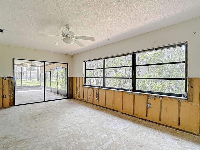 4420 Marine Pkwy, New Port Richey, FL 34652 - empty room with a textured ceiling and a ceiling fan