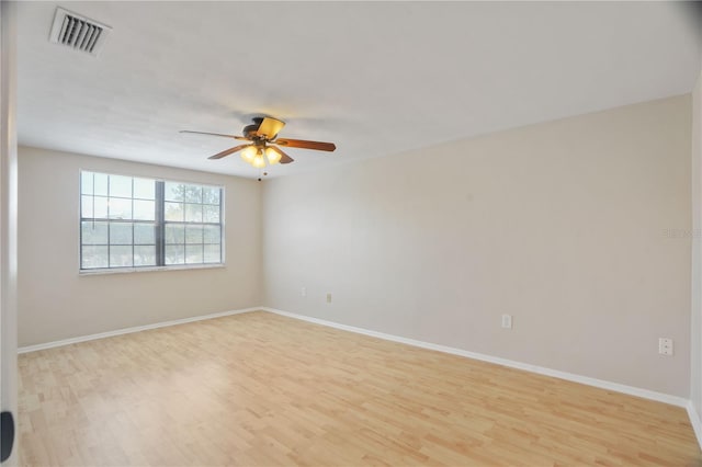 12106 Bear Creek Ln, Hudson, FL 34667 - unfurnished room with light wood-style flooring, a ceiling fan, and baseboards