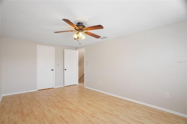 12106 Bear Creek Ln, Hudson, FL 34667 - unfurnished bedroom with light wood-type flooring, baseboards, and ceiling fan