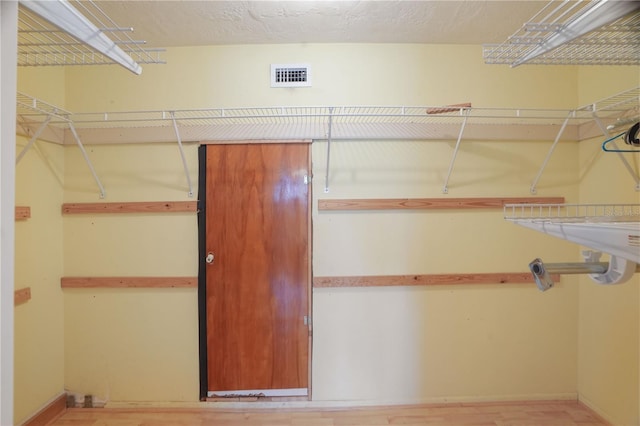 12106 Bear Creek Ln, Hudson, FL 34667 - spacious closet featuring light wood-style flooring