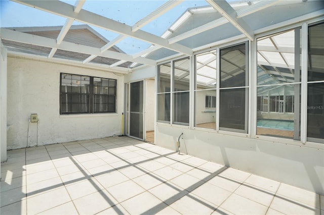 12106 Bear Creek Ln, Hudson, FL 34667 - unfurnished sunroom featuring a skylight and vaulted ceiling