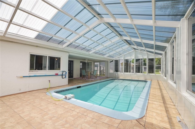 12106 Bear Creek Ln, Hudson, FL 34667 - indoor pool with a patio, ceiling fan, and a lanai