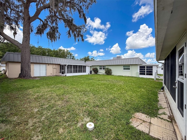 11821 Boynton Ln, New Port Richey, FL 34654 - view of green lawn with a sunroom