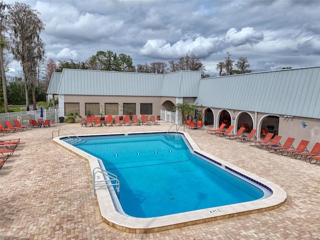 11821 Boynton Ln, New Port Richey, FL 34654 - community pool featuring a patio