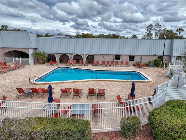 11821 Boynton Ln, New Port Richey, FL 34654 - community pool featuring a patio