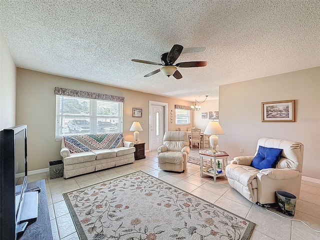 11821 Boynton Ln, New Port Richey, FL 34654 - living room with a ceiling fan, tile patterned flooring, a chandelier, and a textured ceiling