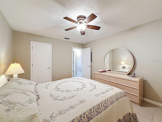 11821 Boynton Ln, New Port Richey, FL 34654 - bedroom featuring a ceiling fan, light tile patterned flooring, and baseboards
