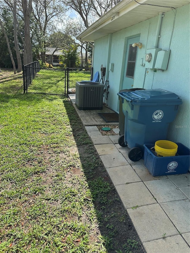 2158 Clayton Ave, Spring Hill, FL 34609 - view of yard featuring central AC unit and a gate
