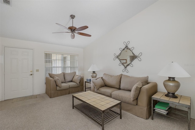 living room with ceiling fan, vaulted ceiling, and carpet floors