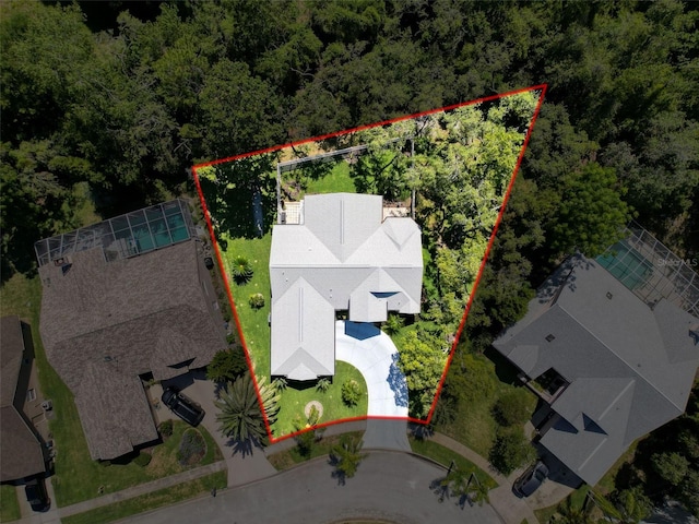 13627 Glaze Brook Dr, Hudson, FL 34667 - aerial view of property and surrounding area featuring property parcel outlined and a forest