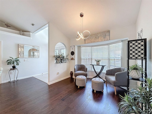 13627 Glaze Brook Dr, Hudson, FL 34667 - sitting room with vaulted ceiling, dark wood-style floors, baseboards, and a chandelier