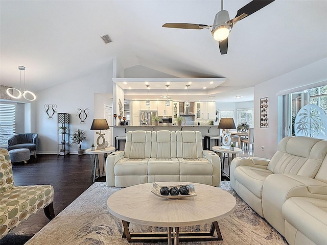 13627 Glaze Brook Dr, Hudson, FL 34667 - living area with ceiling fan, baseboards, lofted ceiling, and wood finished floors