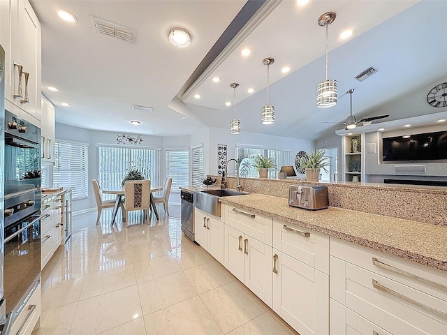 13627 Glaze Brook Dr, Hudson, FL 34667 - kitchen featuring a sink, dishwasher, ceiling fan, light stone counters, and recessed lighting